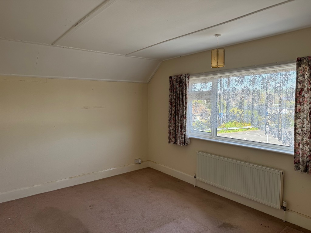 Lot: 130 - TWO-BEDROOM HOUSE FOR IMPROVEMENT - A view of the bedroom